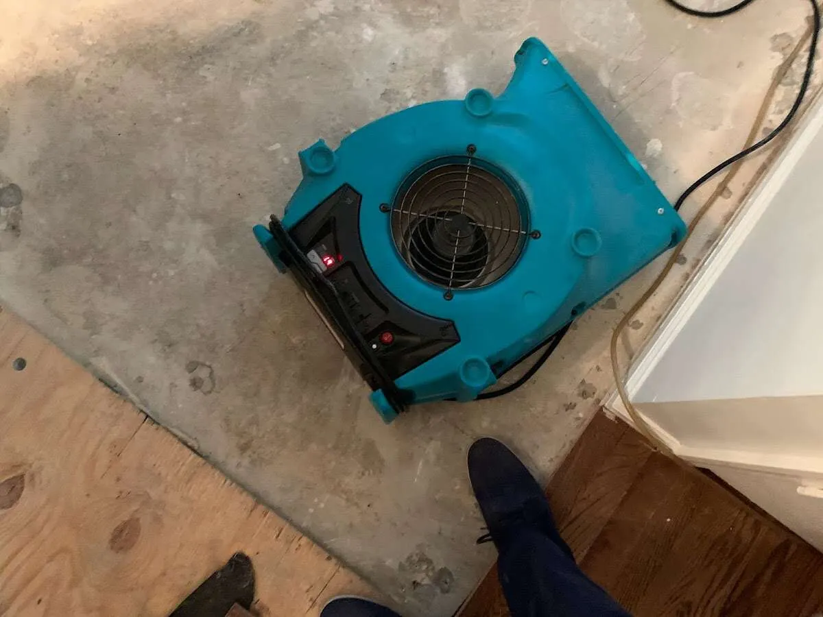 Air mover drying subfloor during Leak Detection & Repair in Texarkana